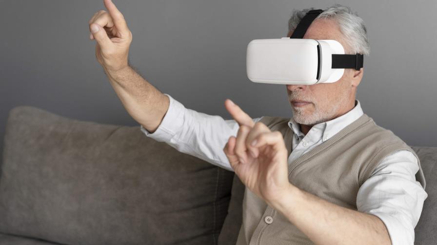 medium-shot-man-wearing-vr-glasses-1-da067416-focus-0-0-896-504