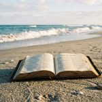 Open_bible_on_sand_202605040905
