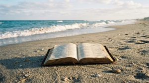 Open_bible_on_sand_202605040905